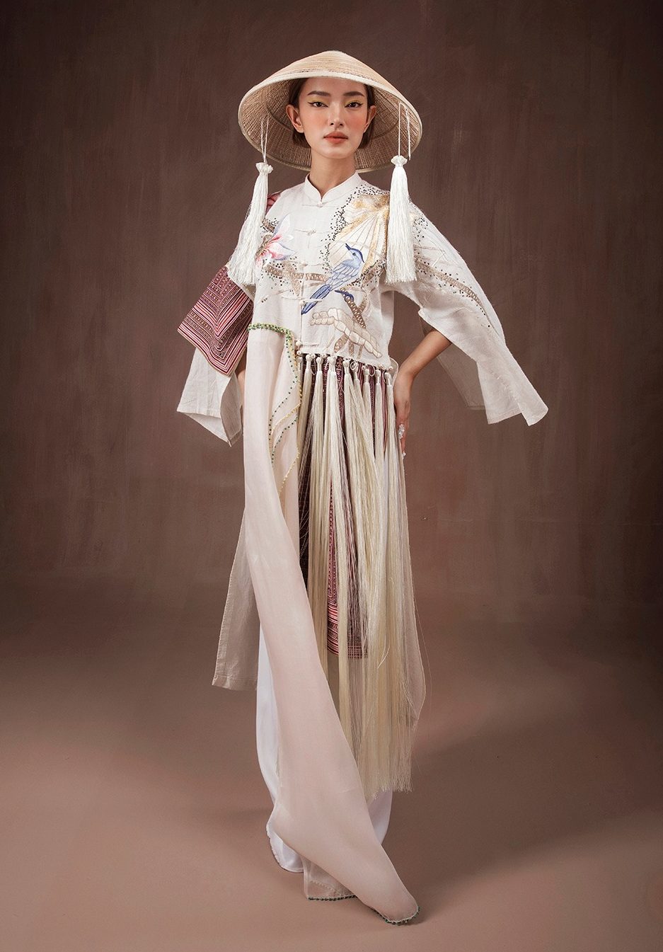 A model wearing Vietnamese traditional clothes made from pineapple fiber