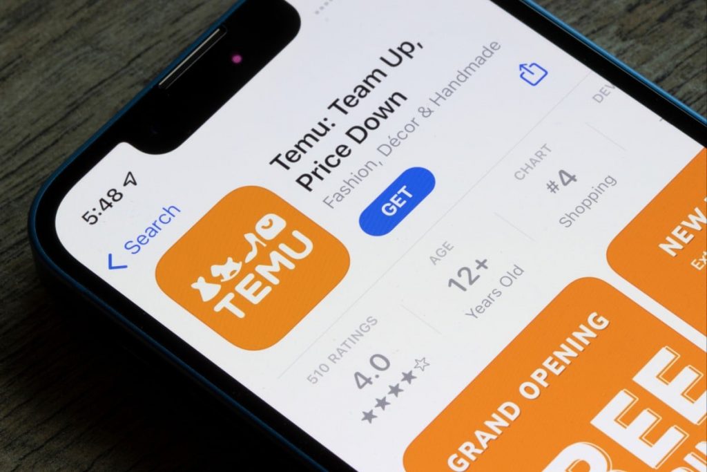 A smartphone shows Temu app